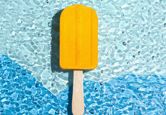 A bath bomb in the shape of an ice cream yellow. Summer concept