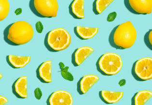 Fresh lemon pattern on a bright color background flat lay