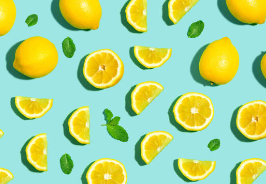 Fresh lemon pattern on a bright color background flat lay